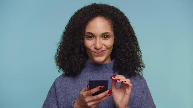Woman Debating Online Purchase on Smartphone on Blue Background