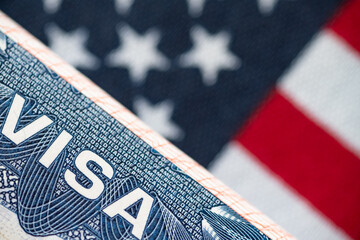 VISA to the USA and the flag of the United States of America. work and travel documents for visiting the USA. Visa for immigration © kosoff