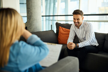 Friendly Conversation Between Colleagues in a Modern Office Lounge Setting