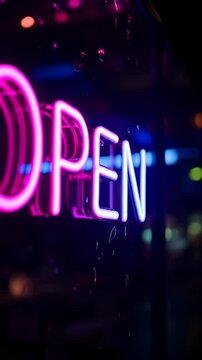 Neon Open Sign Illuminating a Storefront at Night  