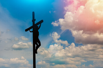 Jesus hanging on a large wooden cross