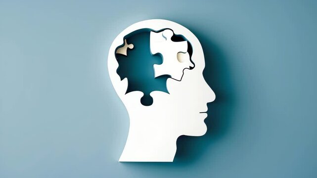Alzheimer's disease, senile dementia, and memory impairment. Silhouette of a head with jigsaw puzzle pieces.