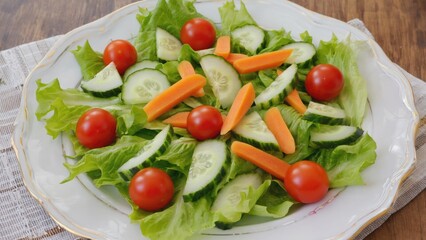 A colorful arrangement of fresh vegetables on a white plate