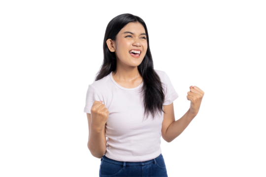 Excited young Asian woman celebrating success with joyful expression and clenched fists, isolated on transparent background