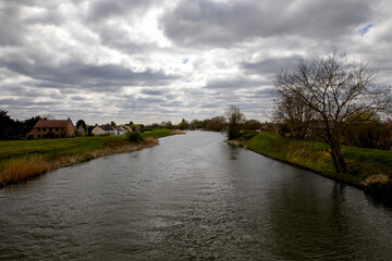 Fototapeta premium An cloudy sky over the River Ouse in Cambridgeshire, UK