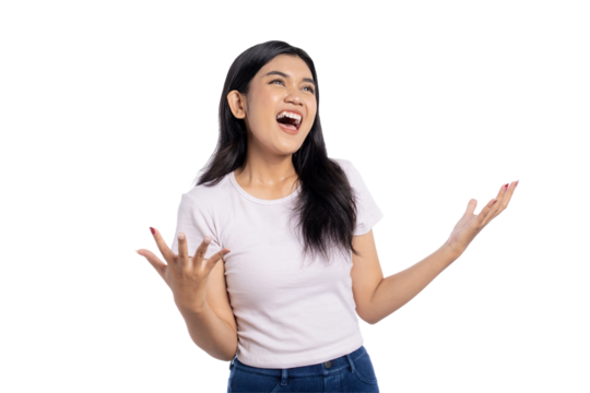 Joyful young Asian woman laughing with raised hands and expressive face, celebrating and excited, isolated on transparent background