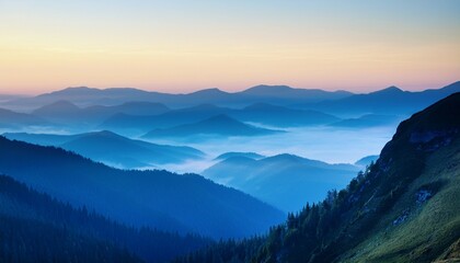 Obraz premium misty blue mountains at sunrise