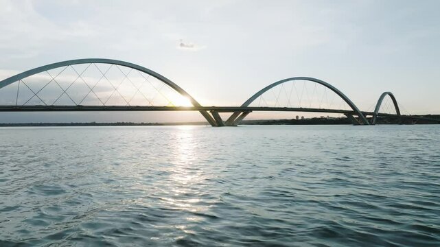 Juscelino Kubitschek Bridge over Paranoa Lake with tranquil ripples under clear sky
