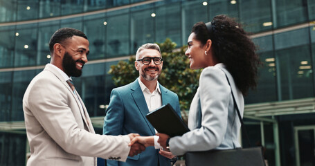City, business people and smile with handshake for welcome, greeting and agreement for realtors....