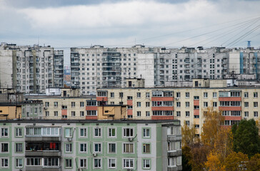 Multi-storey residential buildings in a residential area of eastern Europe on a cloudy day.