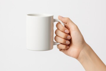 Hand Holding Mug: A human hand gracefully holds a pristine white mug, creating a captivating visual of simplicity and everyday life.