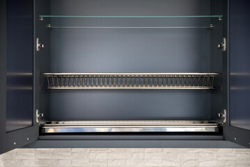Open kitchen cabinet with dish dryer