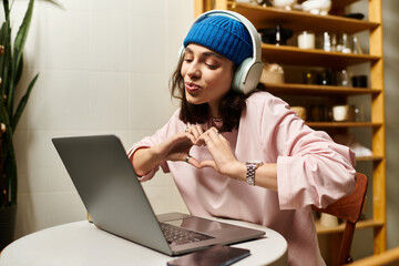 Creative moments of remote work in a cozy cafe with a cheerful young woman