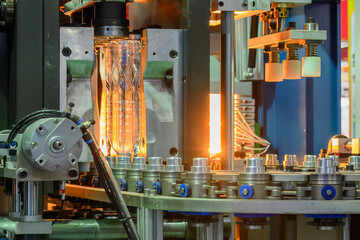 The drinking water bottle manufacturing process by blow mold machine.