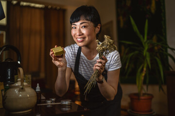 proud japanese woman look at her own product natural handmade soap