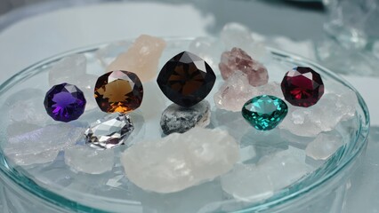 A glass bowl filled with variously colored crystals