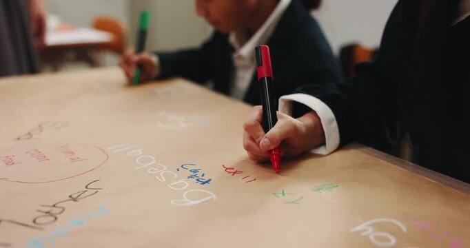 Japanese, hands and children writing for education with language development, literacy game and learning. Kids, students and stationery of fun lesson, english translation and bilingual study in Japan