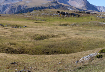 autumn in the mountains, yellowing foothill landscape, the beginning of the autumn period in...