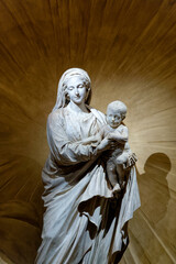 Statue of Blessed Virgin Mary holding baby Jesus Christ in her arms.
