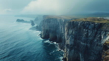 A dramatic view of the Atlantic shoreline with high cliffs and a vast, open horizon, showcasing the rugged and adventurous spirit of the coast