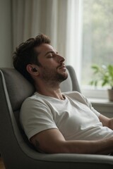 Calm and Serene Young Man with Closed Eyes Wearing Earbuds, Finding Inner Peace Through Meditation or Audio Therapy