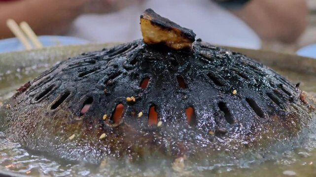 Burned Thai grilled BBQ pan. Carcinogenic and cancer. Dirty Dishes concept.