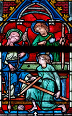 Stained glass (17th century) of Holy family: Jesus infant, Virgin Mary and St Joseph in the workshop of Joseph the carpenter.