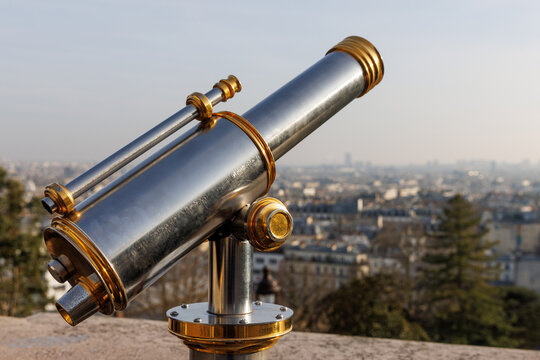 A telescope to watch Paris from Montmartre, France.