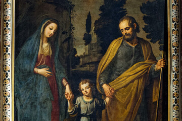 Painting (19th century) of Holy family: Jesus infant between hands of Virgin Mary and St Joseph.