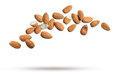 Shelled almonds floating isolated on white background.