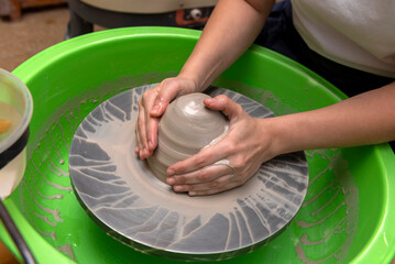 The process of kneading and manufacturing artisanal ceramics and clay by hand and with a wheel,...