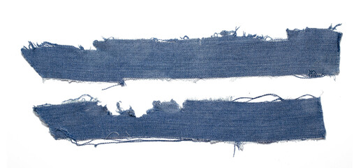 jeans. a frayed and torn piece of denim rag.