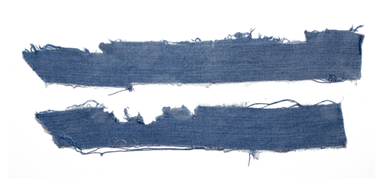 jeans. a frayed and torn piece of denim rag.
