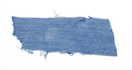 jeans. a frayed and torn piece of denim rag.