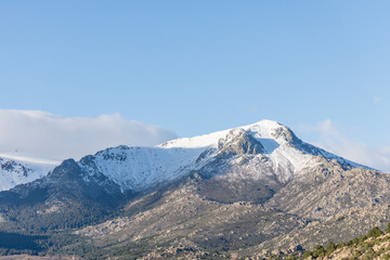 summit of the mountain called La Maliciosa in the Sierra de Guadarrama of Madrid with the communication towers called the Bola del Mundo covered in snow