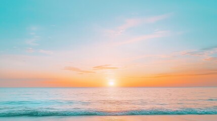 Obraz premium Breathtaking golden sunset on tranquil beach with gentle waves and colorful clouds