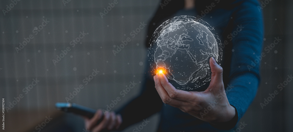 Poster a person holds a digital globe, symbolizing technology and global connectivity, while interacting wi