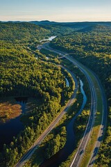 Scenic aerial view of highways merging into forests and rivers