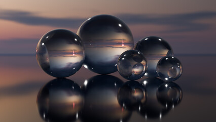 Transparent large balls stand on a glass surface like an abstraction.