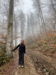 young woman walking in the woods