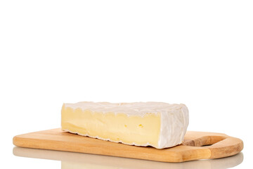 Pieces of fragrant brie cheese on a bamboo cutting board isolated on a white background, close-up.