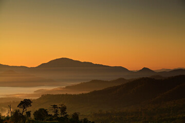 Naklejka premium Sunrise and sea of clouds over Pai District, Mae Hong Son Province, Thailand. View from Yun Lai Viewpoint is Chinese Village