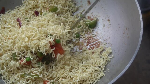 Boil water, add Maggi noodles and seasoning, cook for 2 minutes, stir well, and enjoy a quick, tasty meal.