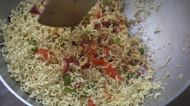 Boil water, add Maggi noodles and seasoning, cook for 2 minutes, stir well, and enjoy a quick, tasty meal.