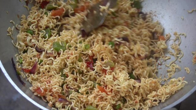 Boil water, add Maggi noodles and seasoning, cook for 2 minutes, stir well, and enjoy a quick, tasty meal.