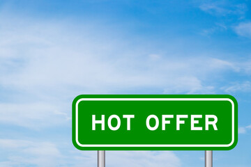 Green color transportation sign with word hot offer on blue sky with white cloud background