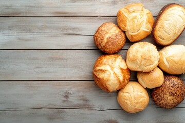 golden-brown assorted bread and pastries artfully arranged on rustic wooden surface with ample copy space
