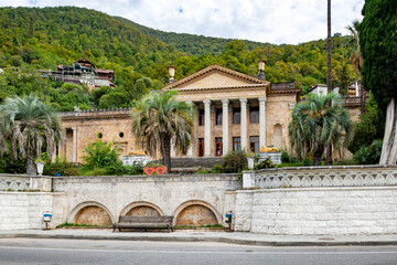 Gagra, Abkhazia-October 11 2024 : Old historical building with columns among the mountains in the...