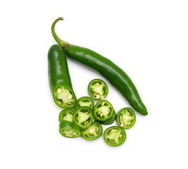 Fresh green cut chili pepper pieces on a white background 