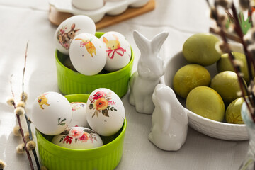 Easter composition with a variety of colored eggs on the table. Easter celebration in the family circle.